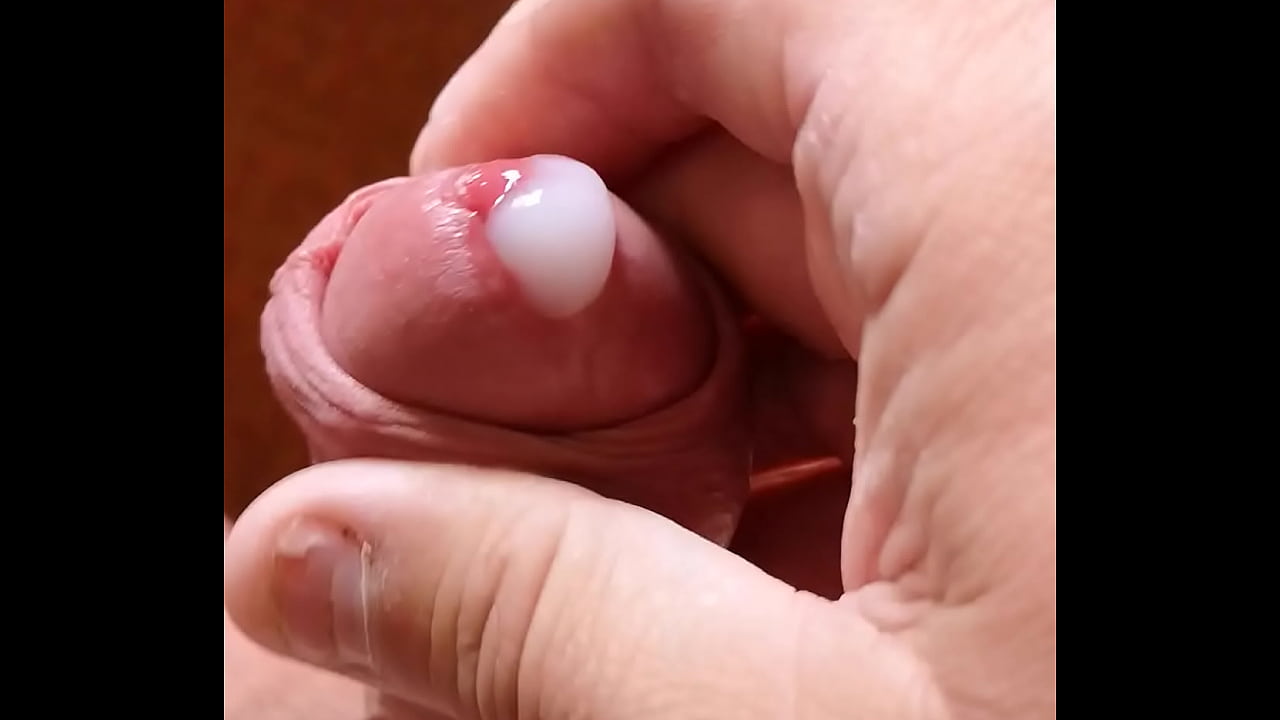 fat guy stroking cock with band