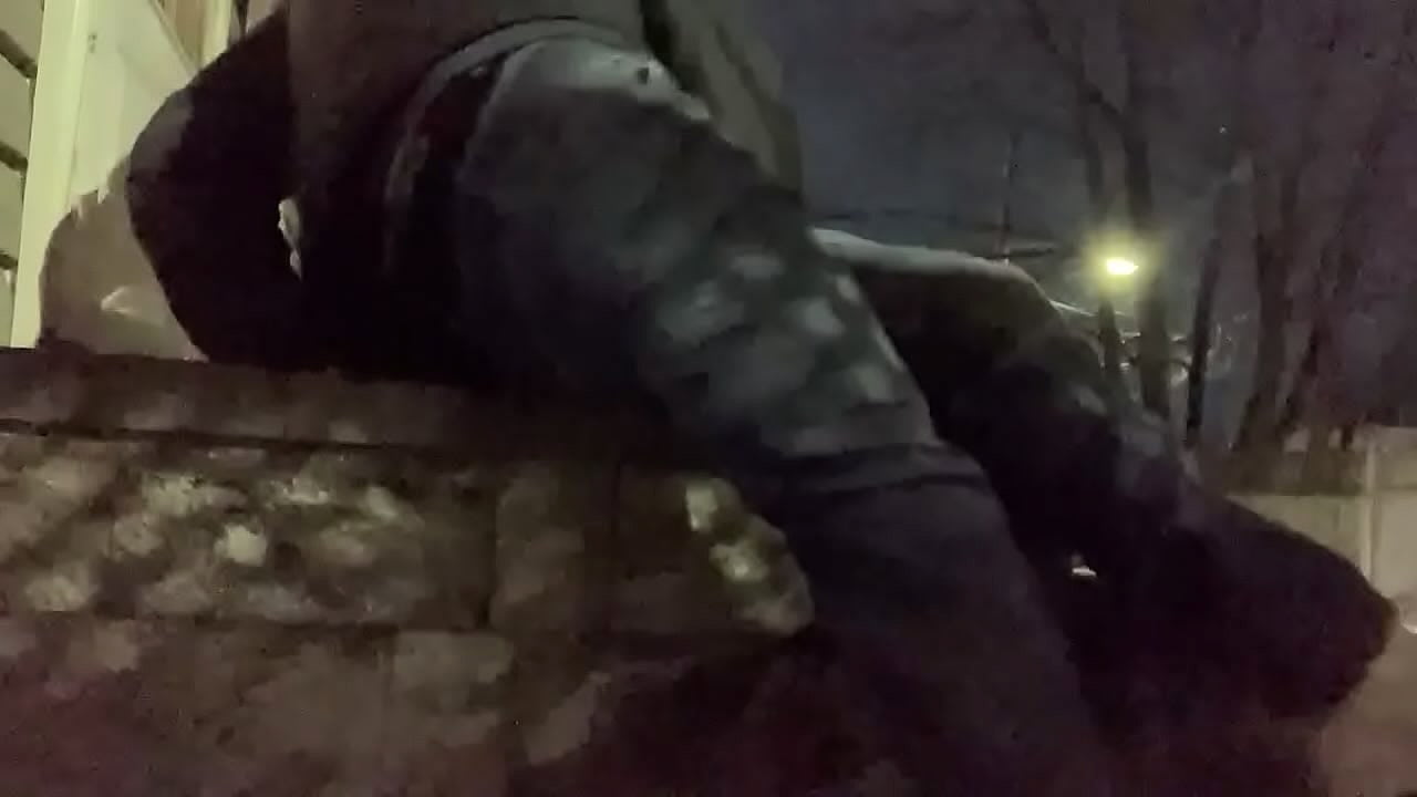 Massage deep fascia with balls on stoop at night