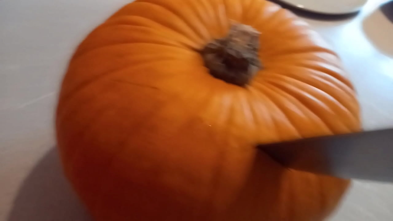Fabulous Asian gay emo femboy crossdresser carves a pumpkin for Halloween