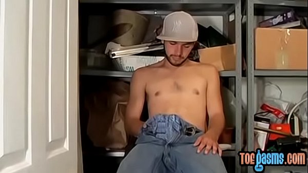 Young man cumshot on feet after wanking