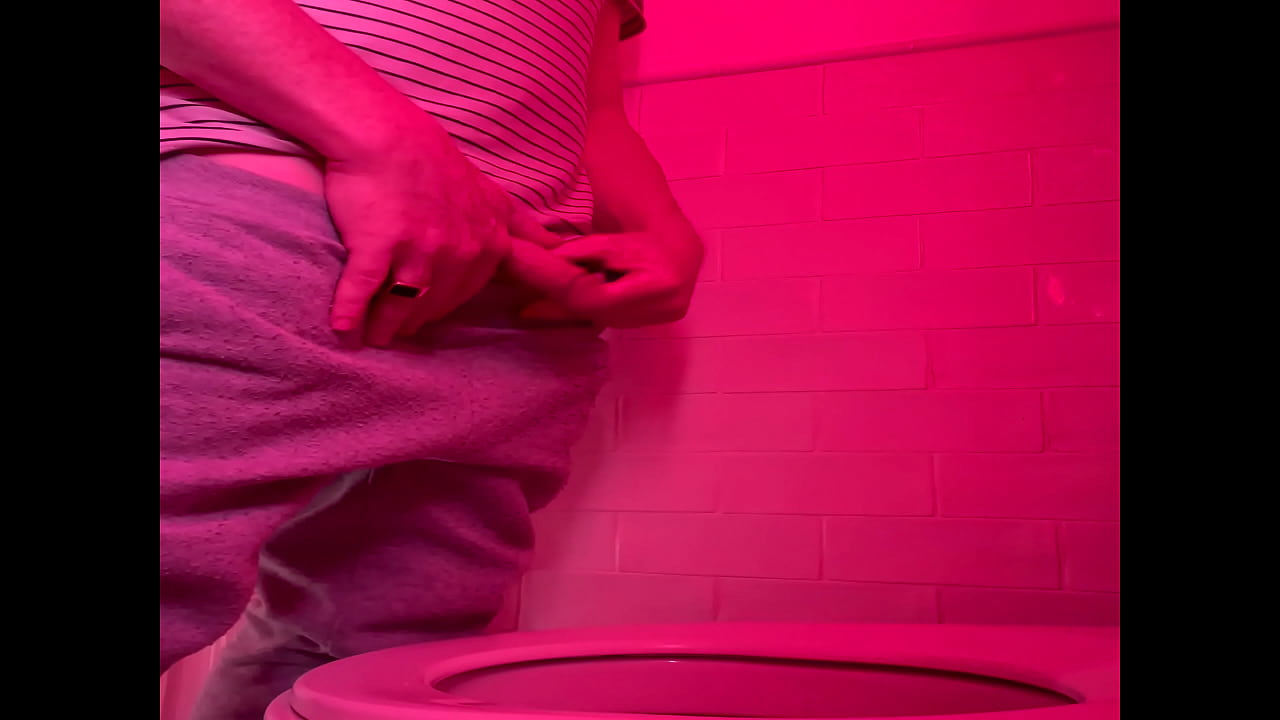 Amateur guy pissing in the toilets of a bar