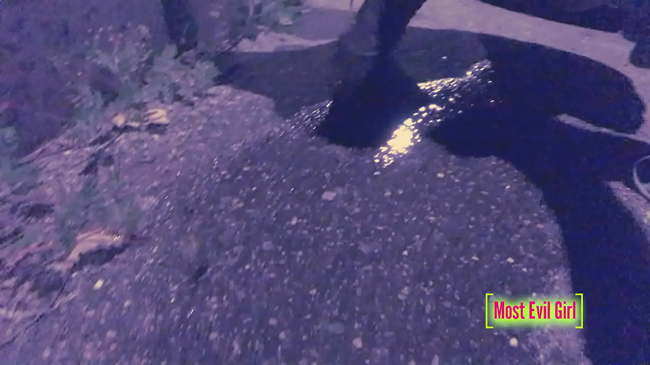 A horny young woman pisses secretly in the street at night, pulling her pants down in public - Full video complete