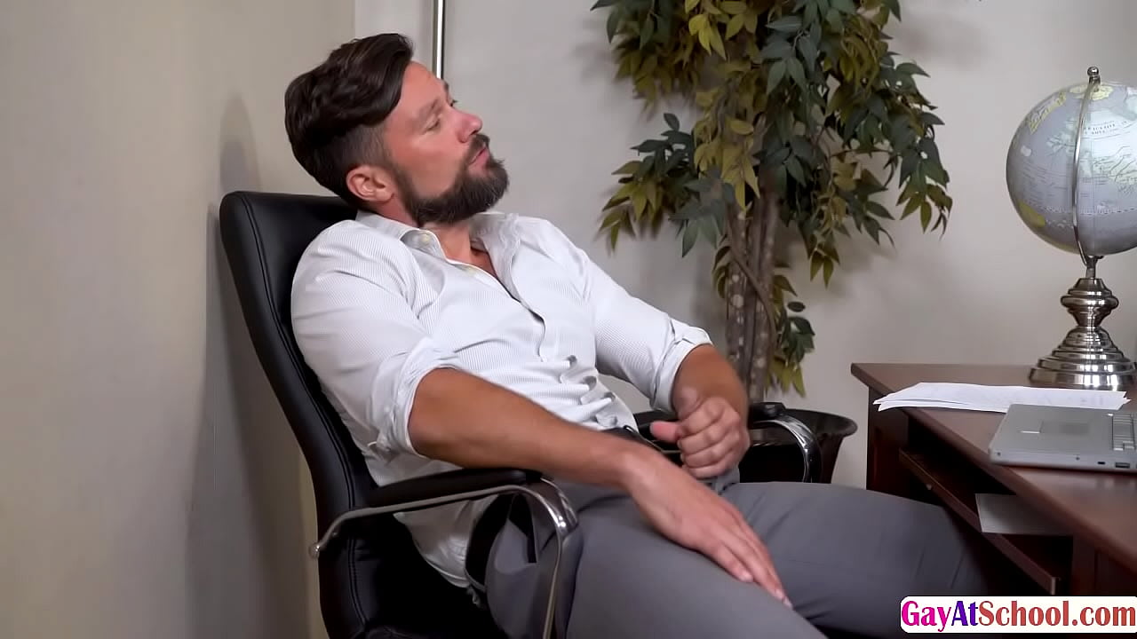 DILF teacher lets teen Rob Quin suck his dick inside his office.After that,he licks his tight ass first