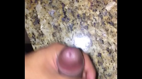 Latino cumming in public restroom