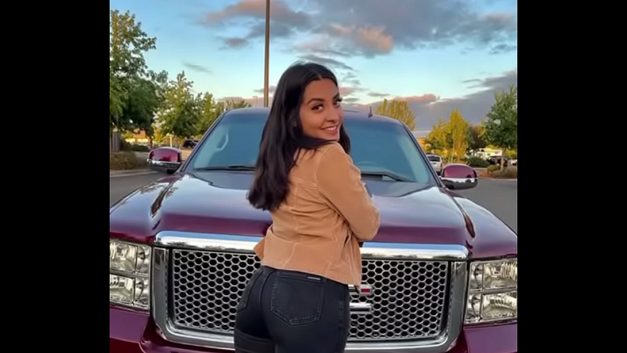 Hot brown haired girl with fat ass and big tits standin on truck