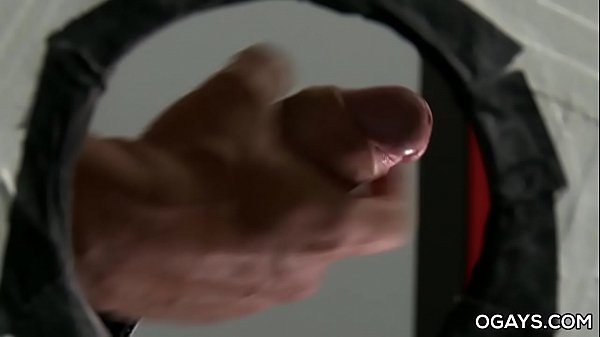 Gay man waiting for his partner in a public toilet