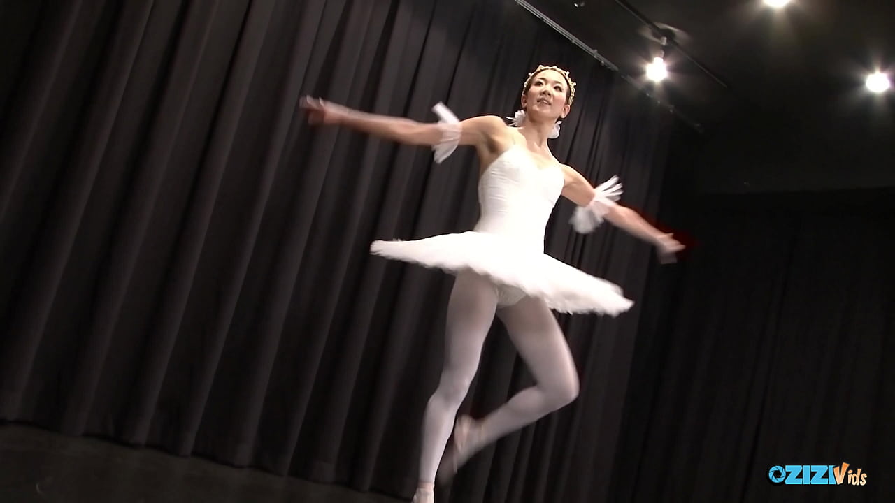 The skilled Asian dancer performs for her audience, exuding delight