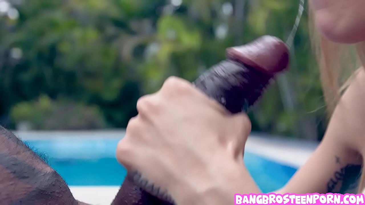 Tiny blonde girl gives head to a black cock