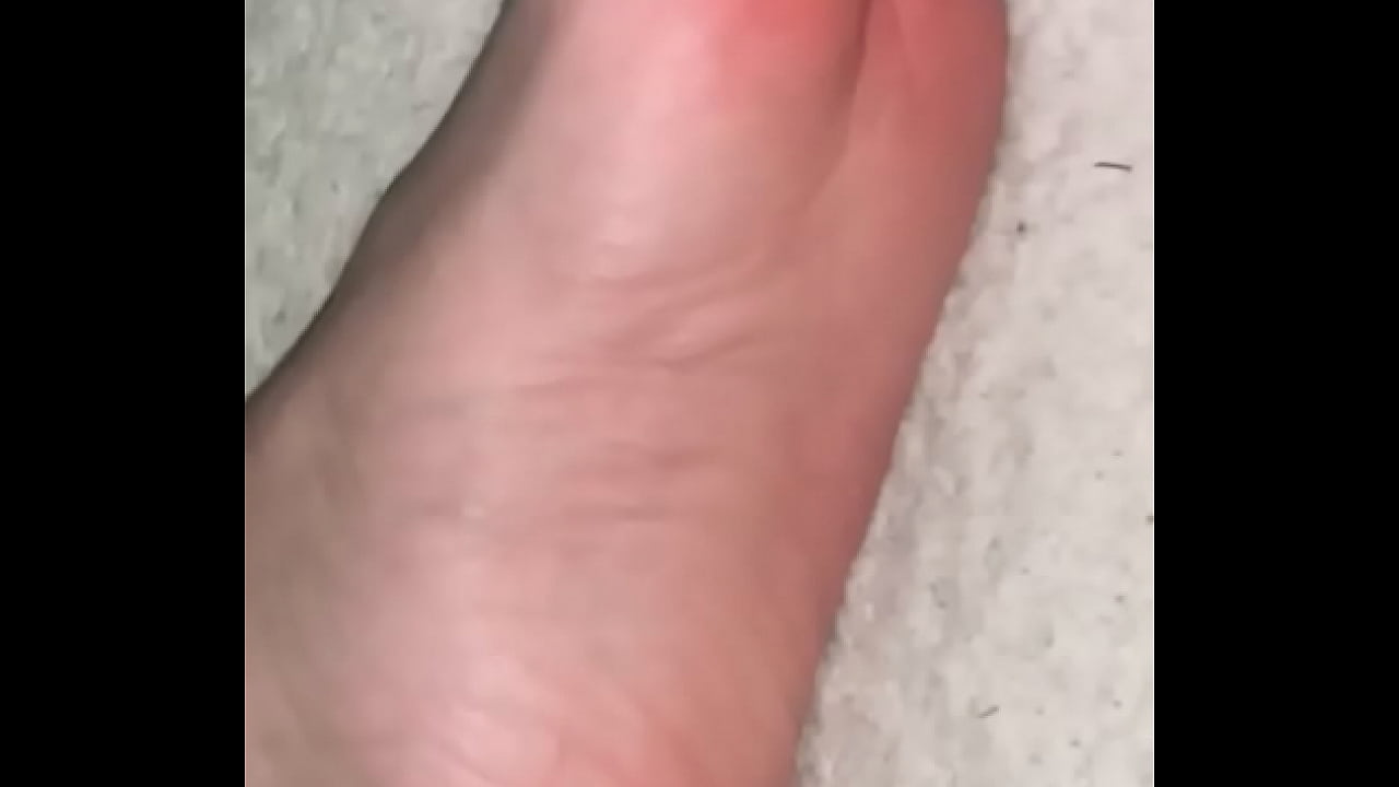 Long white toes wiggling up close looking very suckable