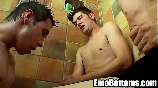 Emo twink sucking on two hard cocks in the shower