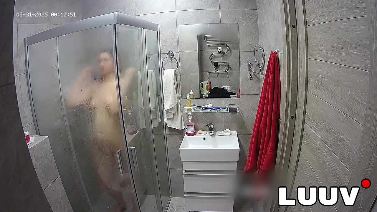 LUUV. A brunette showers, used to amateur cameras, showing her natural body