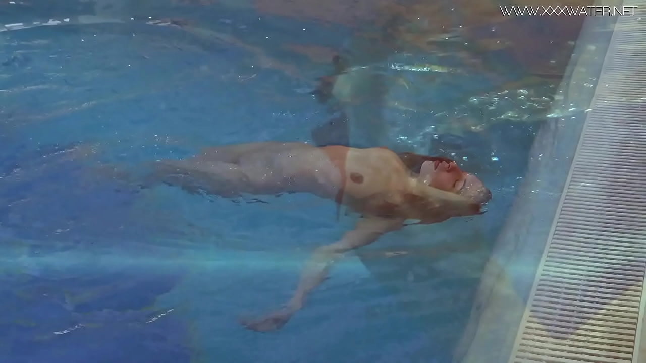 Big tits and ass Lina swims naked in the pool