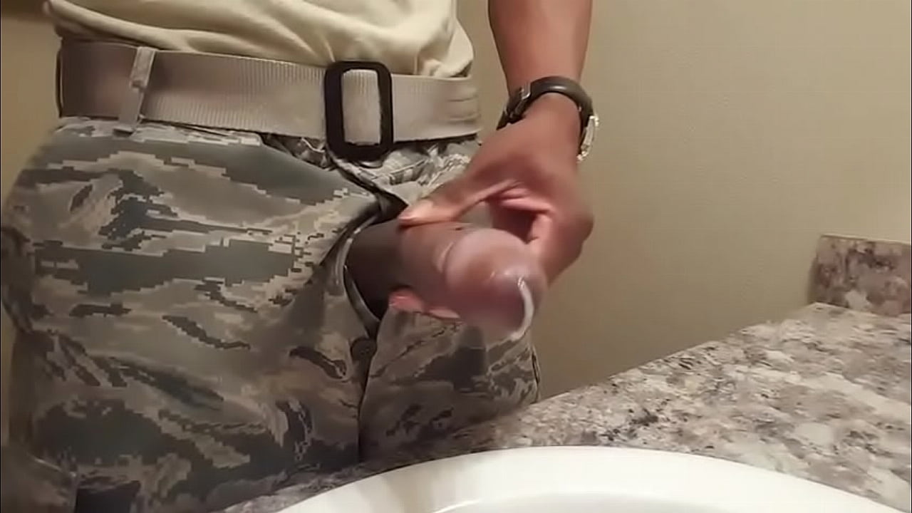 Black soldier wanking in the bathroom