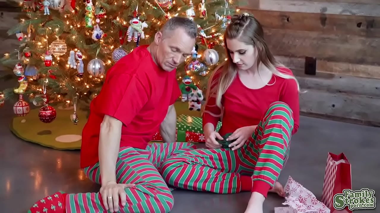 Niki sucked stepdads cock beside the glimmering tree and gagged on his tip so nicely