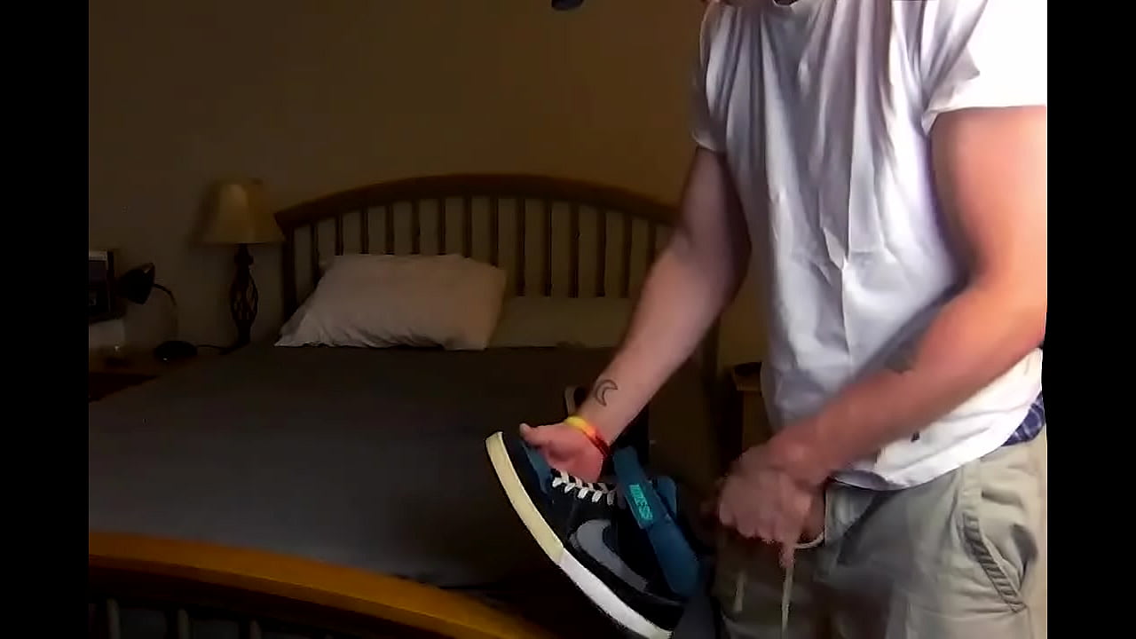 Skater Guy Sniffing his own Skate Shoes