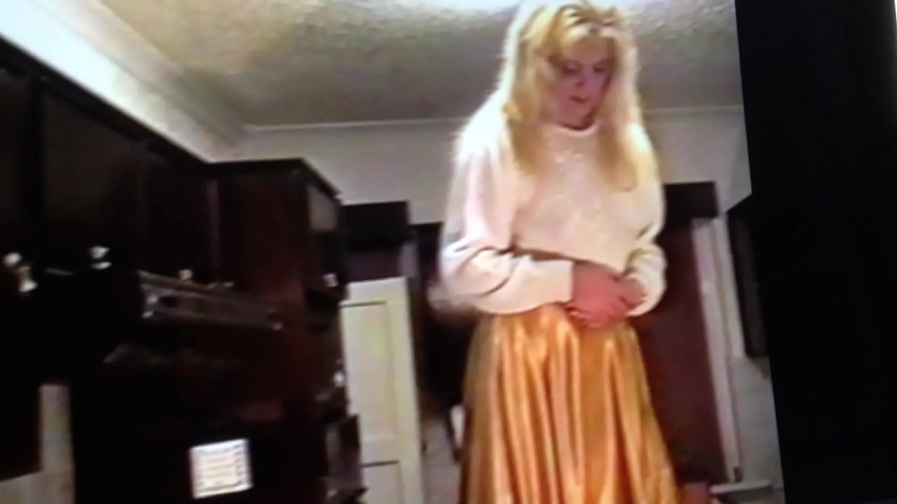 Raising Her Skirt To Comply With His Wishes