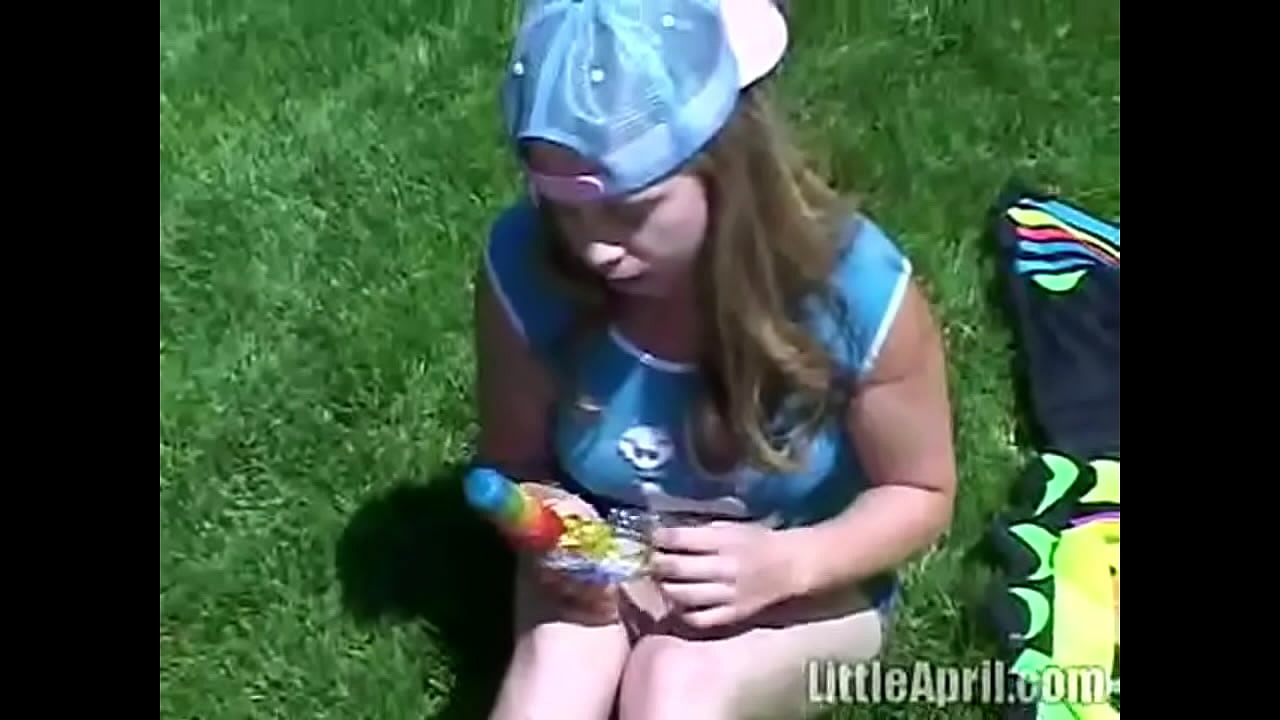 Little April is out in the park showing off her tight vagina