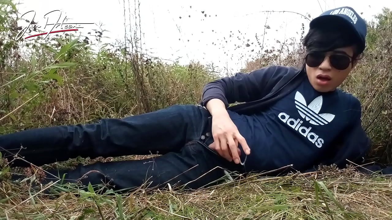 Beautiful slim boy Jon Arteen talks French, jerks off his shaved cock in the rain, lubes with drool, makes sound, cums sticky sperm on his hand