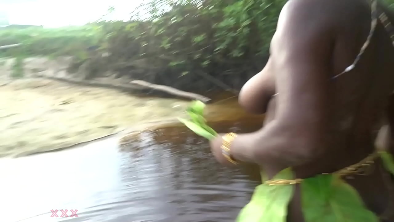 Busty African witch grinding her thick body in ritual dance and cleansing in sacred water