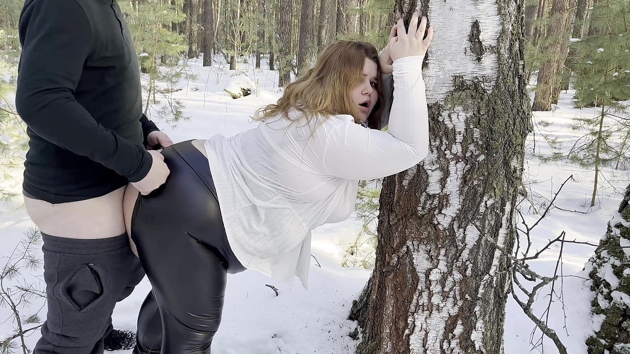 Chubby hitchhiking hottie in black leather leggings sucked cock in the woods and set up a huge juicy ass for a hard fuck right in the snow