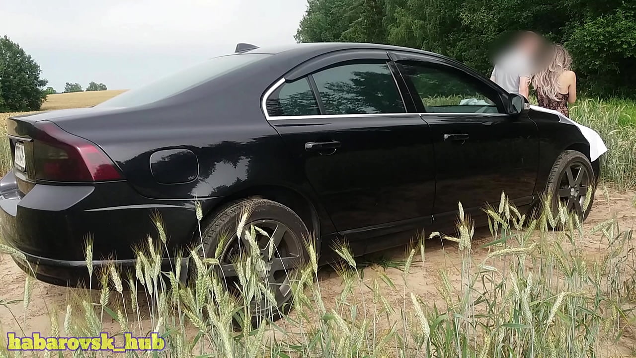 sexy hot wife in a photo session near the car