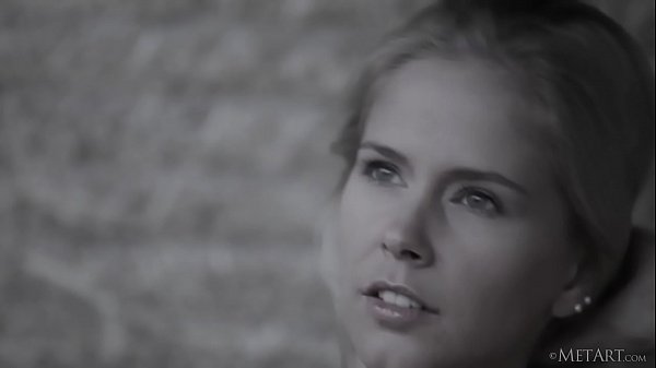 Beautiful blonde babe Tracy A removing her clothes on a straw bale