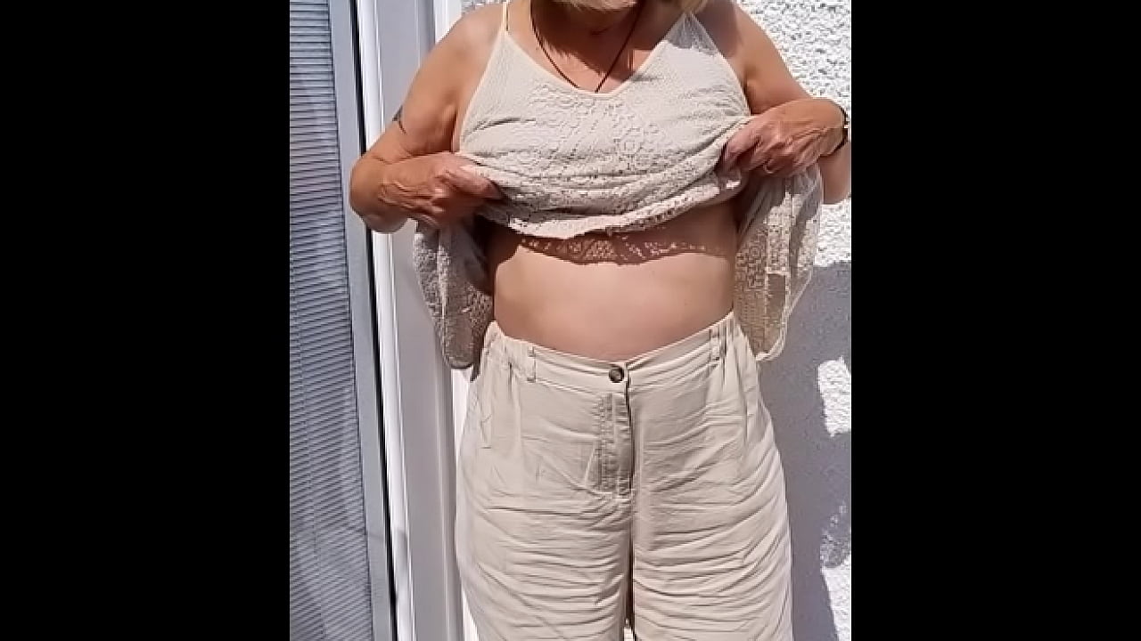 Flopping her tits out outdoors