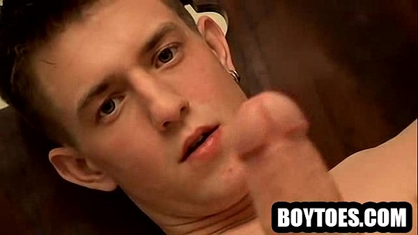 Amateur hunk tugging on his rock hard cock in bed