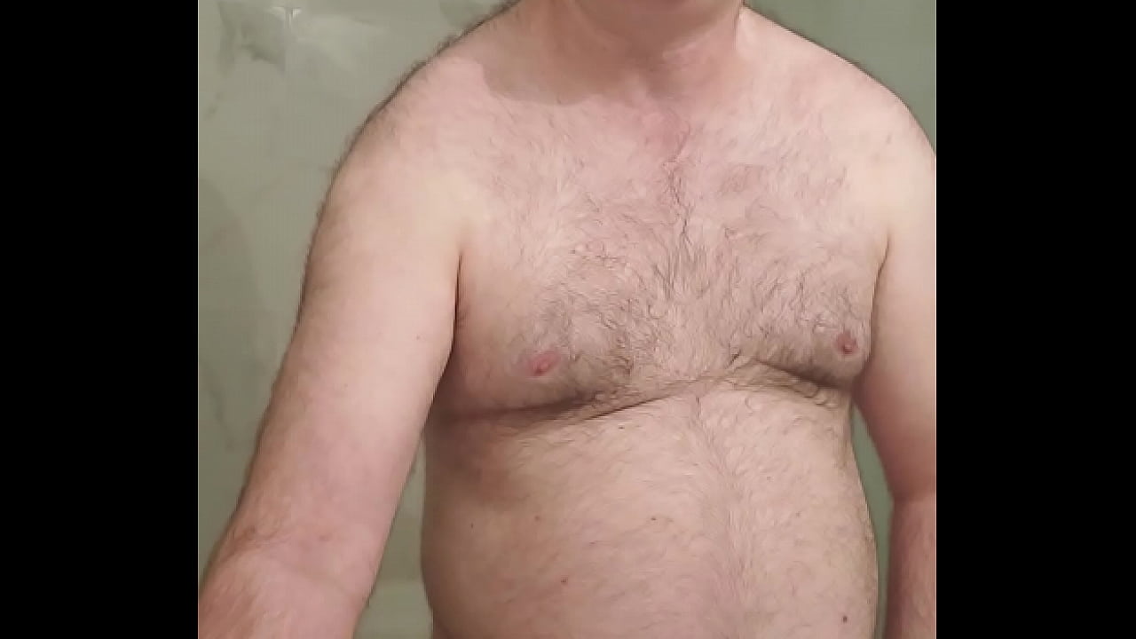 Naked Martin Lavall&eacute;e juxtaposes his little cock cage with his ten inch gode