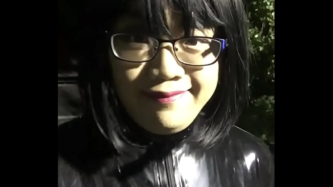 latex crossdresser walking toy at public