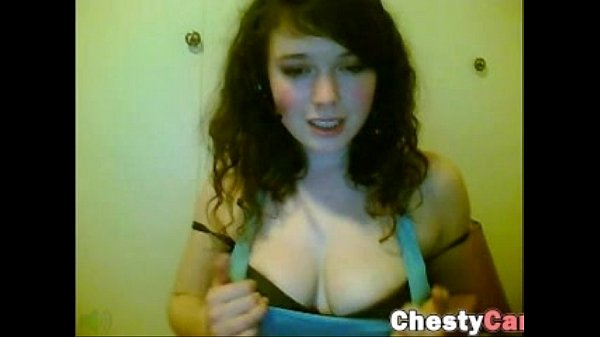 Busty teen brunette reveals her tits