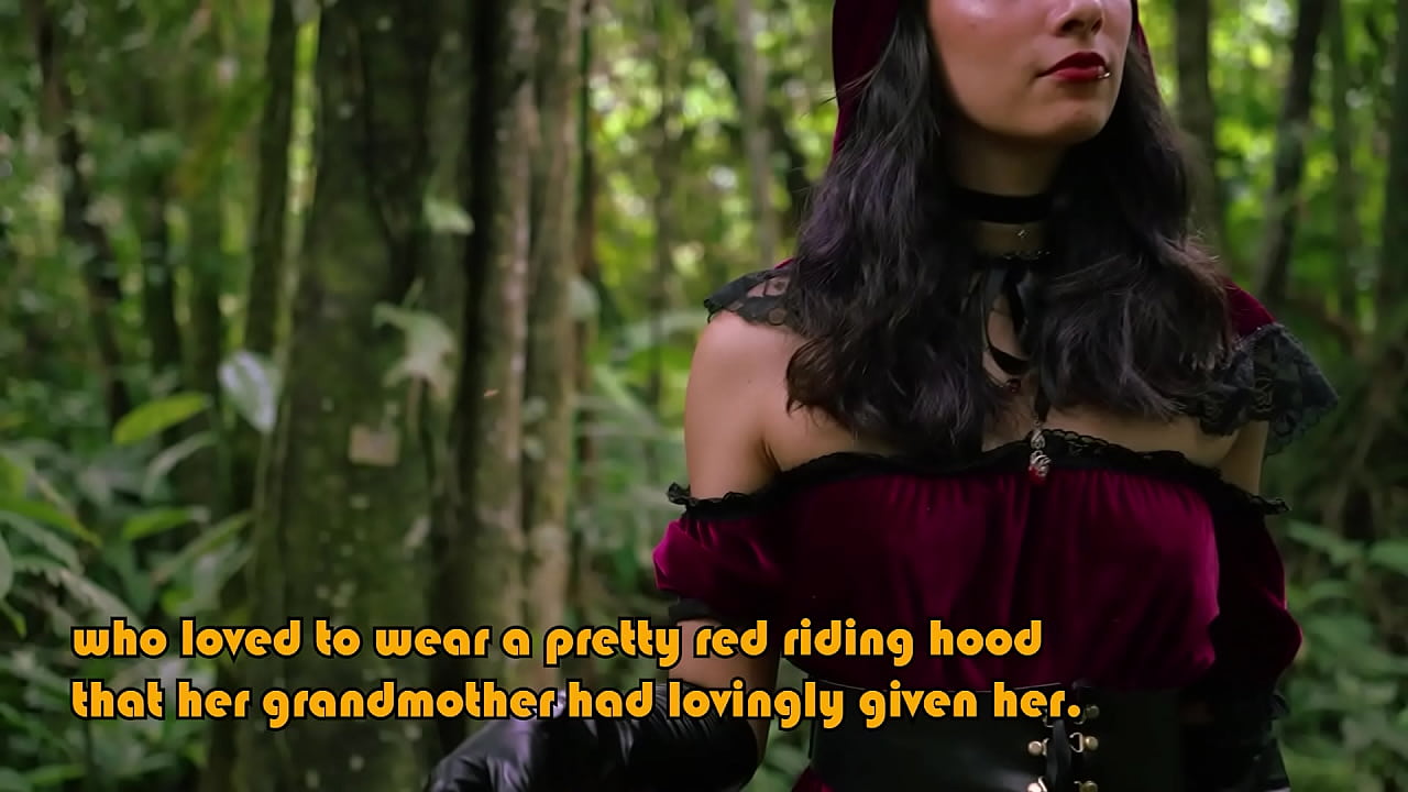 Little Red Riding Hood walking alone in the forest