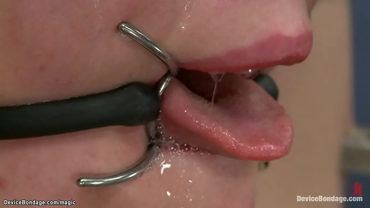 Lean forward and locked in steel device lesbian slave Claire Robbins gets caned then on the floor chained and candle waxed pussy vibrated by lezdom Mz Berlin in dungeon