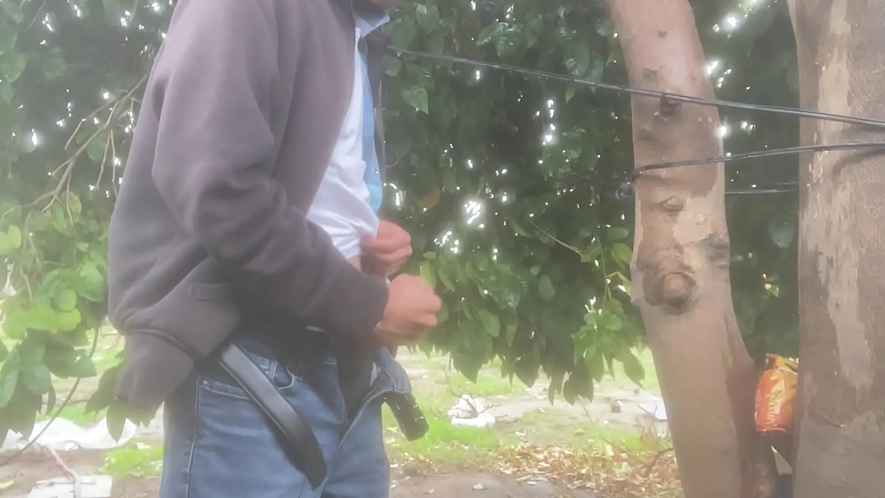 Jerking off behind a tree in the rain