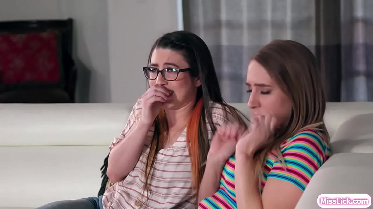 Gorgeous blonde and sexy brunette rent the same house for vacation.They decide to share the house and a few moments,they watch together horror movies.After that,they start kissing each other and they lick their wet pussies on the couch.