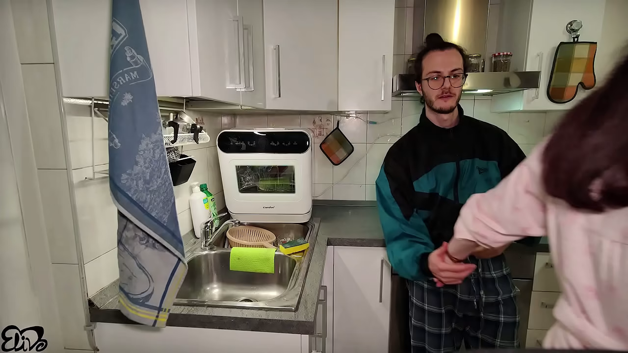 Pregnant woman does tit wank in the kitchen after washing the dishes