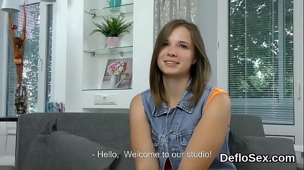 Cuddly half-nude babe tickles her opened hymen in close up