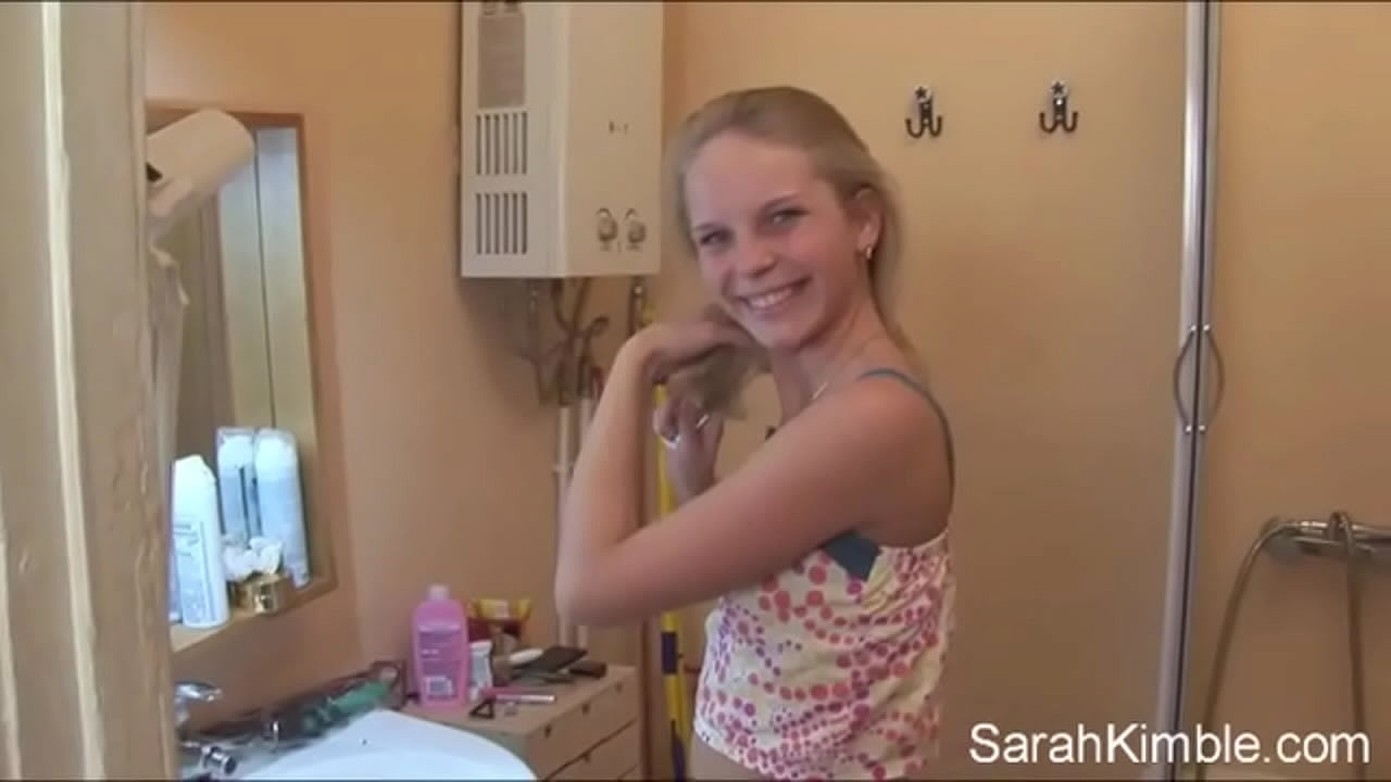 Sweet Sarah strip off her clothes and showing natural tits and shaved pussy. She Fingering her pussy deeply in comport room