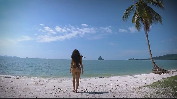 Hot brunette wear micro bikini on a beach and tease