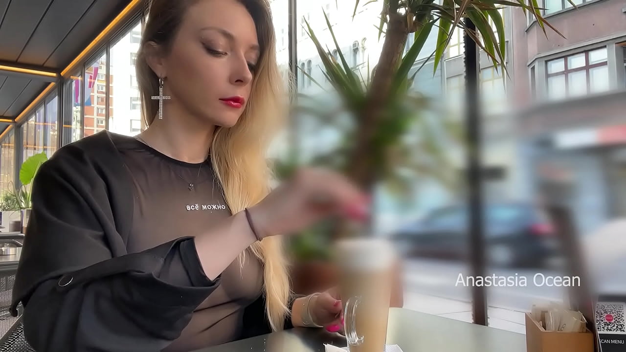 Drinking coffee and flashing boobs in cafe with people around.