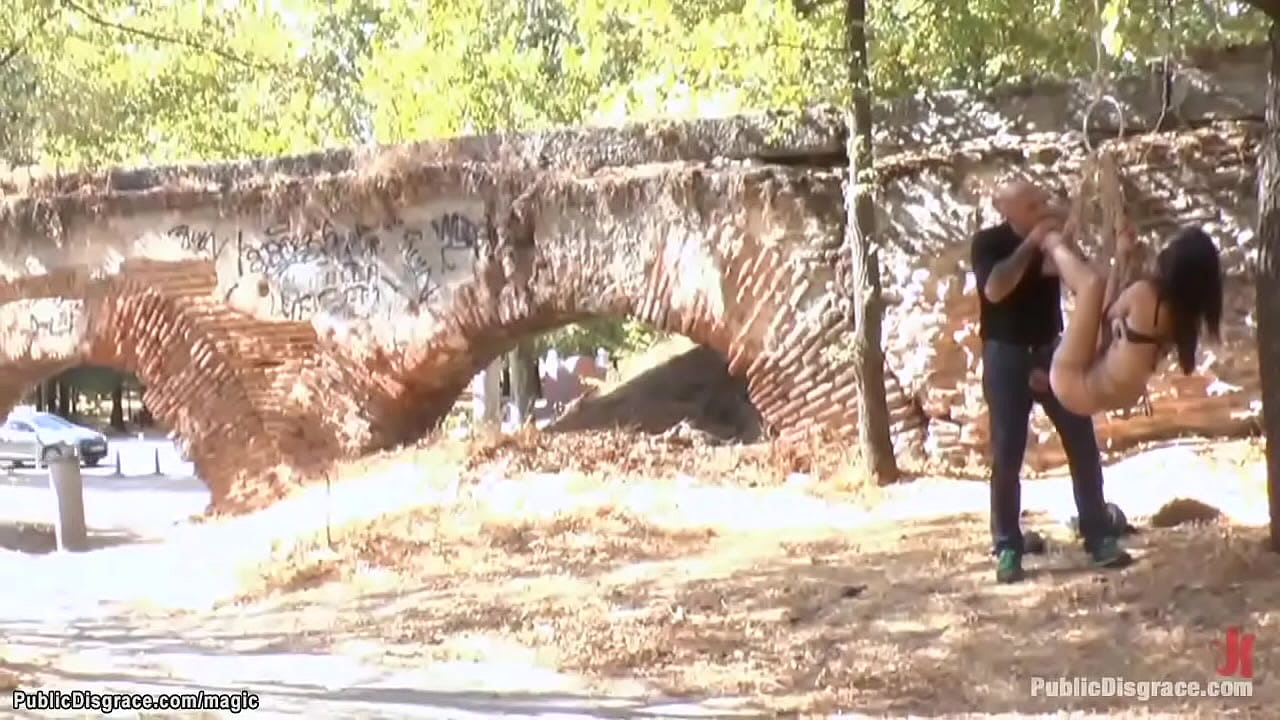 Bare boobs brunette slave Carol Vega with leather mask on her head gets walked on the public streets then spanked and fucked in different places by Omar Galanti