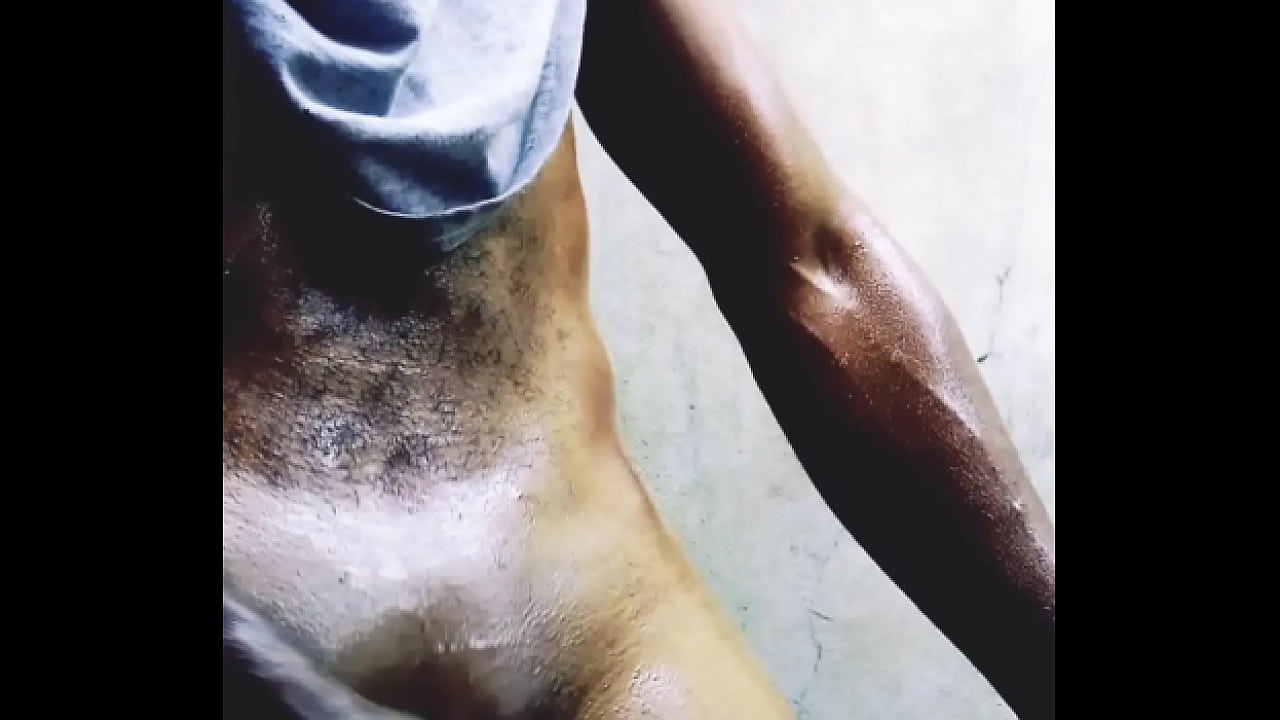 African horny man getting oiled-up, giving his dick a GOOD RUB