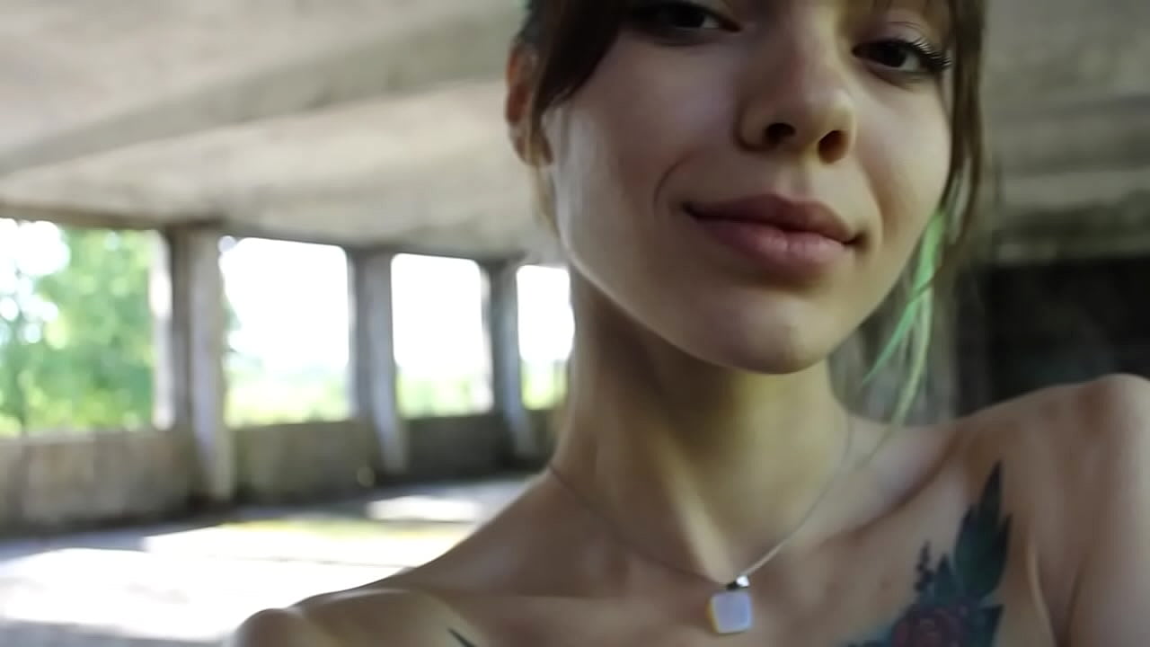 Flexible brunette naked doing sports in an abandoned house