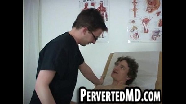 Hot hunk doctor in glasses is giving headto patient