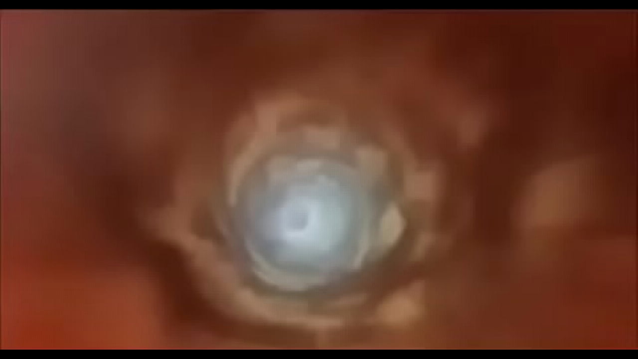 a tiny man swallowed alive by a giant caramel woman