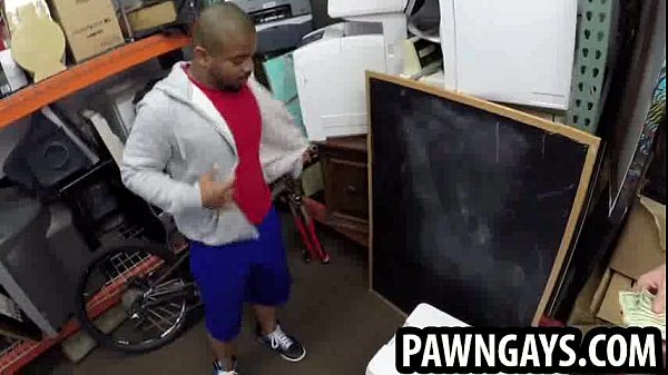Ebony hunk sucking on two cocks at the pawn shop