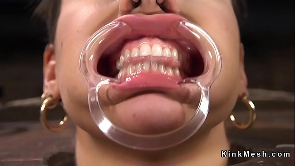 Hogtied brunette slave gets her feet tormented and paddled