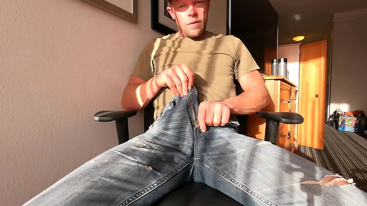 Wetting jeans in front of a hotel window