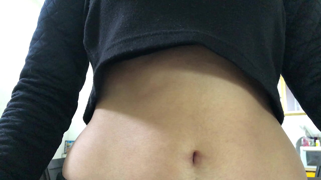 Oval shaped navel close up and looking inside her navel