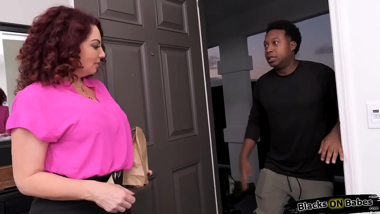 Redhead milf Kiki Daire is teasing the black delivery guy.She starts stripping,showing off her big tits.The cougar sucks his bbc then rides on him